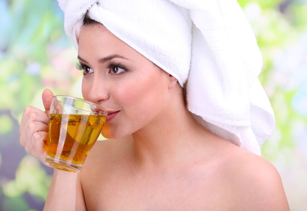 girl drinking tea to rejuvenate skin